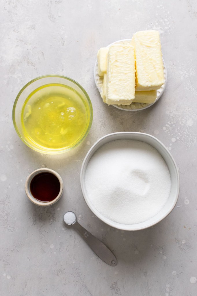 An overhead view of the ingredients needed to make Swiss buttercream frosting. 