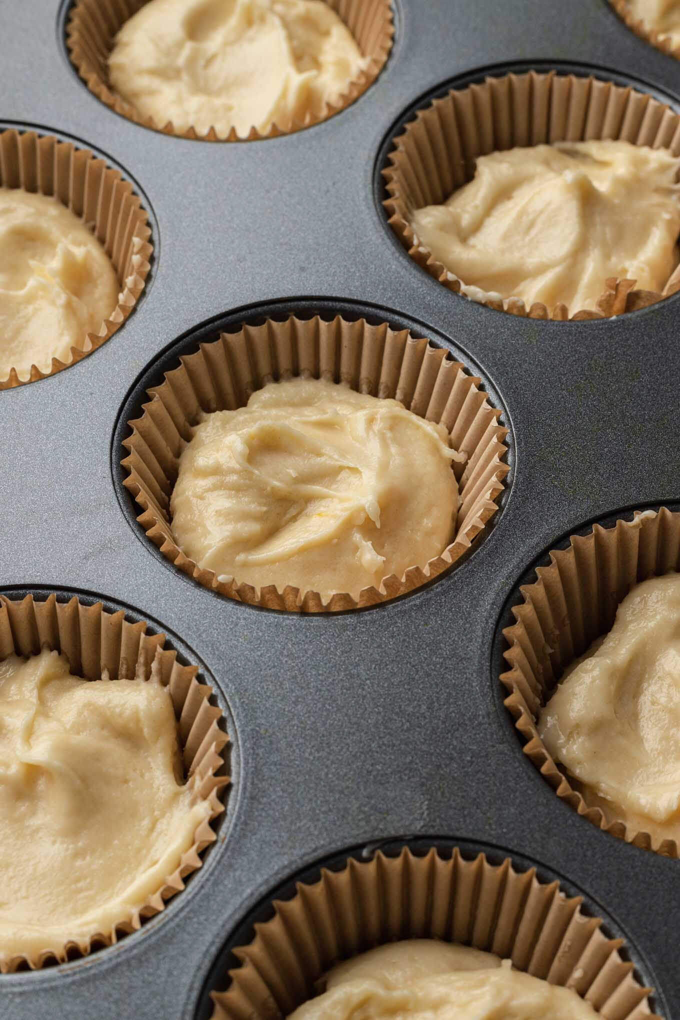 Vanilla cupcakes ready to be baked in the oven. 