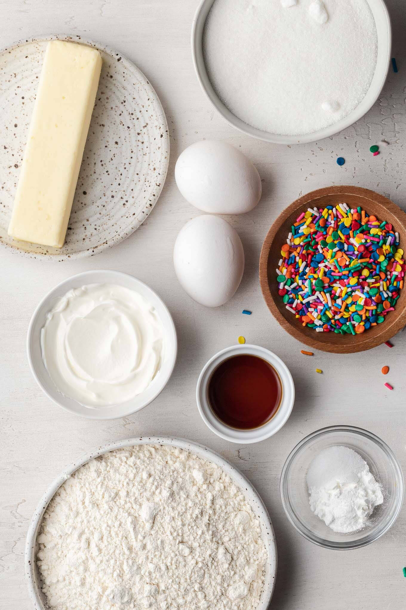 Overhead view of the ingredients needed to make vanilla cupcakes from scratch.