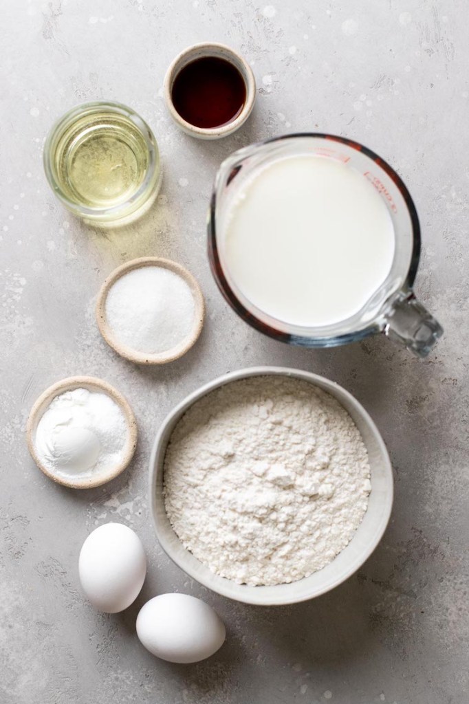 An overhead view of the ingredients needed to make homemade waffles. 